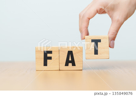 wooden block FAT. Fitness, Exercise, Healthy, Wellness, motivation and wellbeing concepts wooden block FAT. Fitness, Exercise, Healthy, Wellness, motivation and wellbeing concepts 135849076