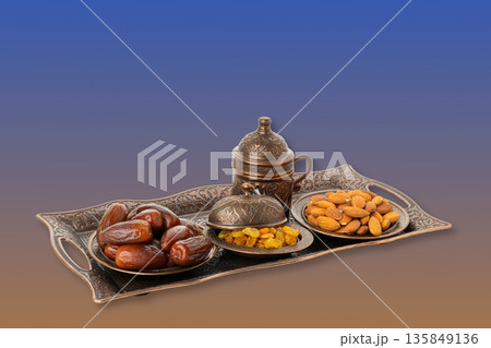 Enjoy a lovely platter of dates, nuts, and dried fruits Enjoy a lovely platter of dates, nuts, and dried fruits 135849136