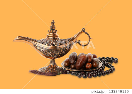 Charming Ramadan decor: lamp, dates, and prayer beads 135849139