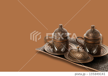 Traditional cups and a decorative tray create a festive setting 135849141
