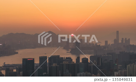 Jan 18 2026 Hong Kong island sunset over Kowloon harbour. 135849831