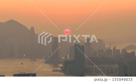Jan 18 2026 Hong Kong island sunset over Kowloon harbour. Jan 18 2026 Hong Kong island sunset over Kowloon harbour. 135849833