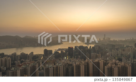 Jan 18 2026 Warm Sunset Illuminates Hong Kong Skyline And Victoria Harbour 135849867