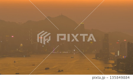 Jan 18 2026 Golden sunset illuminating Hong Kong iconic Victoria Harbour Jan 18 2026 Golden sunset illuminating Hong Kong iconic Victoria Harbour 135849884