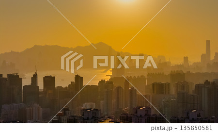 Jan 18 2026 Golden sunset illuminating Hong Kong iconic Victoria Harbour 135850581