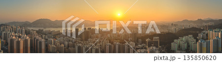 Jan 18 2026 Hong Kong island sunset over Kowloon harbour. 135850620