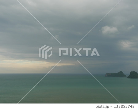 Gray Cumulonimbus cloud formations on sky above mountain, Nimbus moving in wetlands, Appearance of rain cloud, Lake while rain falling in Thailand Gray Cumulonimbus cloud formations on sky above mountain, Nimbus moving in wetlands, Appearance of rain cloud, Lake while rain falling in Thailand 135853748