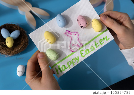 Drawing Easter rabbit bunny Storytelling of creating craft Easter greeting card holiday present. Tactile hand-on activity. Master class progress of creative me-made gifts. Seasonal domestic life micro 135854785