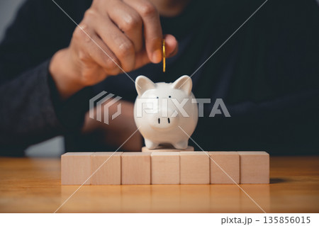 A closeup of a man hand pose making a gesture as a sign of saving money, a positive sign for financial planning, investment and building wealth for the future A closeup of a man hand pose making a gesture as a sign of saving money, a positive sign for financial planning, investment and building wealth for the future 135856015