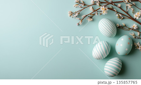 Elegant Easter Eggs with Floral Branch on Soft Mint Background for Spring Celebration Elegant Easter Eggs with Floral Branch on Soft Mint Background for Spring Celebration 135857765