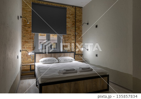 Private double room in a loft hostel with warm bedside lighting 135857834