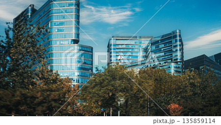 Modern Office Buildings with Curved and Contemporary Facade Architecture Urban Skyline 135859114