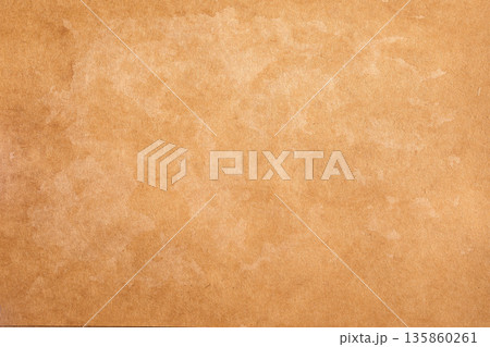 Old rustic brown vintage distressed parchment paper texture with brown stains Old rustic brown vintage distressed parchment paper texture with brown stains 135860261