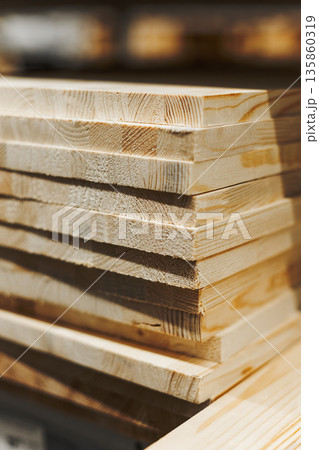 Close-Up Of Stacked Wooden Boards Highlighting Their Clean Edges 135860319