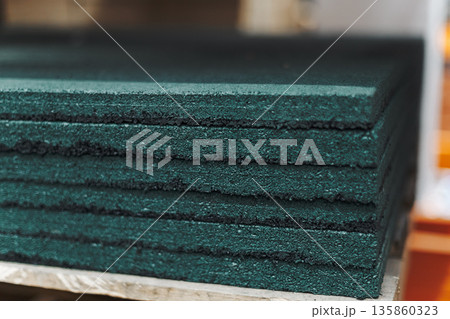 Stack Of Thick, Textured Green Rubber Mats Stack Of Thick, Textured Green Rubber Mats 135860323
