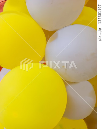 Extreme Close Up of Yellow and White Round Balloons for Festive Background and Party Decor Extreme Close Up of Yellow and White Round Balloons for Festive Background and Party Decor 135861197