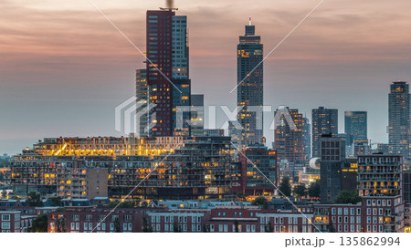 Aerial day to night timelapse of Katendrecht peninsula and Maashaven harbour in Rotterdam, The Netherlands. 135862994
