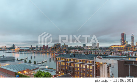 Aerial panoramic view over Maashaven day to night timelapse in Rotterdam. 135863001