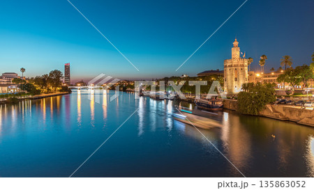Guadalquivir River near Torre del Oro day to night timelapse in Seville, Spain 135863052