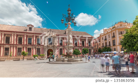 Archbishop Palace of Seville and Fuente Farola Fountain on Plaza de Virgen de los Reyes timelapse 135863056