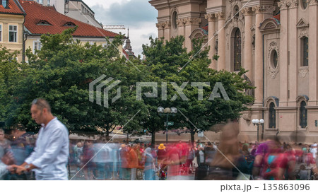 The Church of St. Nicholas behind the trees timelapse in Prague, Czech Republic 135863096