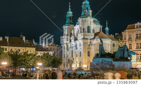 Baroque St. Nicholas' Cathedral on the Oldtown Square in Prague with monument Jan Hus illuminated at night timelapse Baroque St. Nicholas' Cathedral on the Oldtown Square in Prague with monument Jan Hus illuminated at night timelapse 135863097