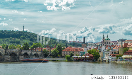 Vltava river embankment timelapse in a sunny summer day. Prague, Czech Republic. Vltava river embankment timelapse in a sunny summer day. Prague, Czech Republic. 135863112