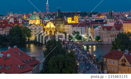 Aerial view of the Old Town architecture and Charles Bridge over Vltava river day to night timelapse in Praha Aerial view of the Old Town architecture and Charles Bridge over Vltava river day to night timelapse in Praha 135863135