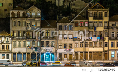 Traditional quaint houses in the old, vintage and touristic ribeira district of Porto at night timelapse, Portugal Traditional quaint houses in the old, vintage and touristic ribeira district of Porto at night timelapse, Portugal 135863245