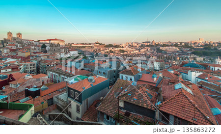 Sunset time, shadow covering Douro riverside with the Dom Luiz bridge timelapse, Porto , Portugal. 135863272