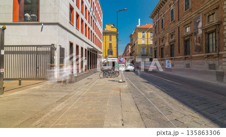 The street with ancient buildings in the center of Milan timelapse hyperlapse, Italy 135863306