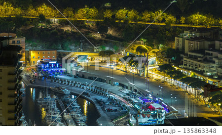 Cityscape of Monte Carlo, Monaco night timelapse with yachts and traffic on embankment. Cityscape of Monte Carlo, Monaco night timelapse with yachts and traffic on embankment. 135863348