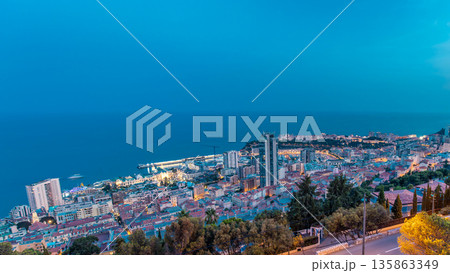 Cityscape of Monte Carlo, Monaco day to night timelapse with roofs of buildings after summer sunset. 135863349