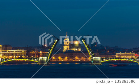 Night view of spit of Vasilyevsky Island and opened Birzhevoy Bridge with rostral column timelapse, Saint Petersburg, Russia. Night view of spit of Vasilyevsky Island and opened Birzhevoy Bridge with rostral column timelapse, Saint Petersburg, Russia. 135863390