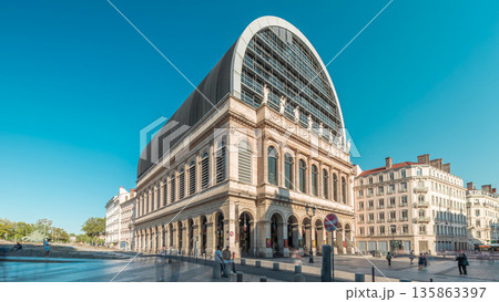 Hyperlapse of Lyon's opera house featuring neoclassical architecture combined with a modern glass dome roof. France Hyperlapse of Lyon's opera house featuring neoclassical architecture combined with a modern glass dome roof. France 135863397