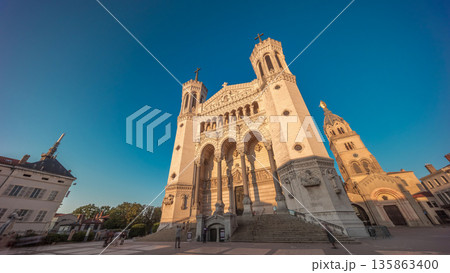Hyperlapse front view of the Basilica of Notre Dame de Fourviere during sunset in Lyon, France. 135863400