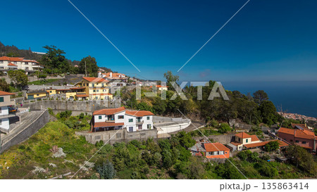 Aerial view from the mountain over the rooftops from cable car on Madeira timelapse hyperlapse. Aerial view from the mountain over the rooftops from cable car on Madeira timelapse hyperlapse. 135863414