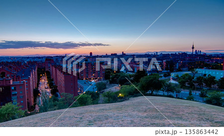 Panoramic day to night timelapse view of Madrid, Spain. Photo taken from the hills of Tio Pio Park, Vallecas-Neighborhood. 135863442