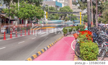 Red cycling track in the Jose Larco avenue and bicycle parking timelapse in Miraflores, Lima Peru 135863569