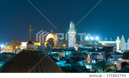 Skyline of the Old City in Jerusalem with historic buildings aerial night timelapse, Israel. 135863744
