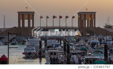 Yachts and boats at the Sharq Marina night to day timelapse in Kuwait. Kuwait City, Middle East 135863797