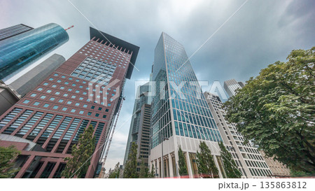 Hyperlapse looking up perspective at glass skyscrapers in Frankfurt's Innenstadt district. Germany Hyperlapse looking up perspective at glass skyscrapers in Frankfurt's Innenstadt district. Germany 135863812