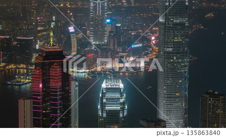 Hong Kong city skyline aerial timelapse at night with Victoria Harbor and skyscrapers 135863840