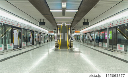 Subway train station interior timelapse in Central, Hong Kong. MTR is the most popular transport in Hong Kong 135863877