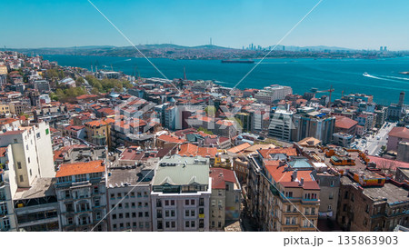 The view from Galata Tower to Golden Horn and Bosphorus, city skyline with red roofs timelapse, Istanbul, Turkey The view from Galata Tower to Golden Horn and Bosphorus, city skyline with red roofs timelapse, Istanbul, Turkey 135863903