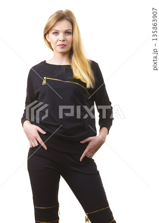 Woman wearing black top Woman wearing black top 135863907