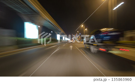 Road and tunnel on the Palm Jumeirah island in Dubai at night, UAE timelapse Road and tunnel on the Palm Jumeirah island in Dubai at night, UAE timelapse 135863960