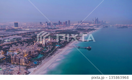Skyline view of Dubai from night to day transition, UAE. Timelapse 135863968
