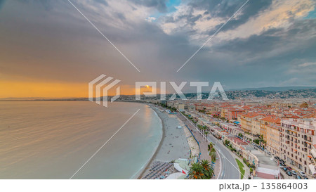 Sunset over Nice city and Mediterranean Sea aerial timelapse 135864003
