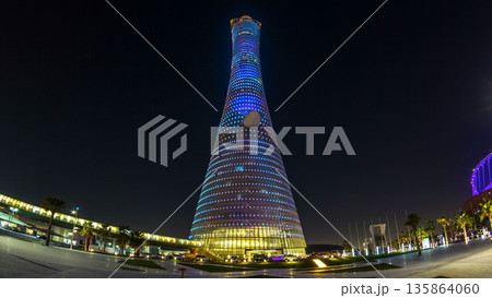 The Aspire Tower or Torch Hotel timelapse in Doha Sports City at night. Doha, Qatar, Middle East 135864060